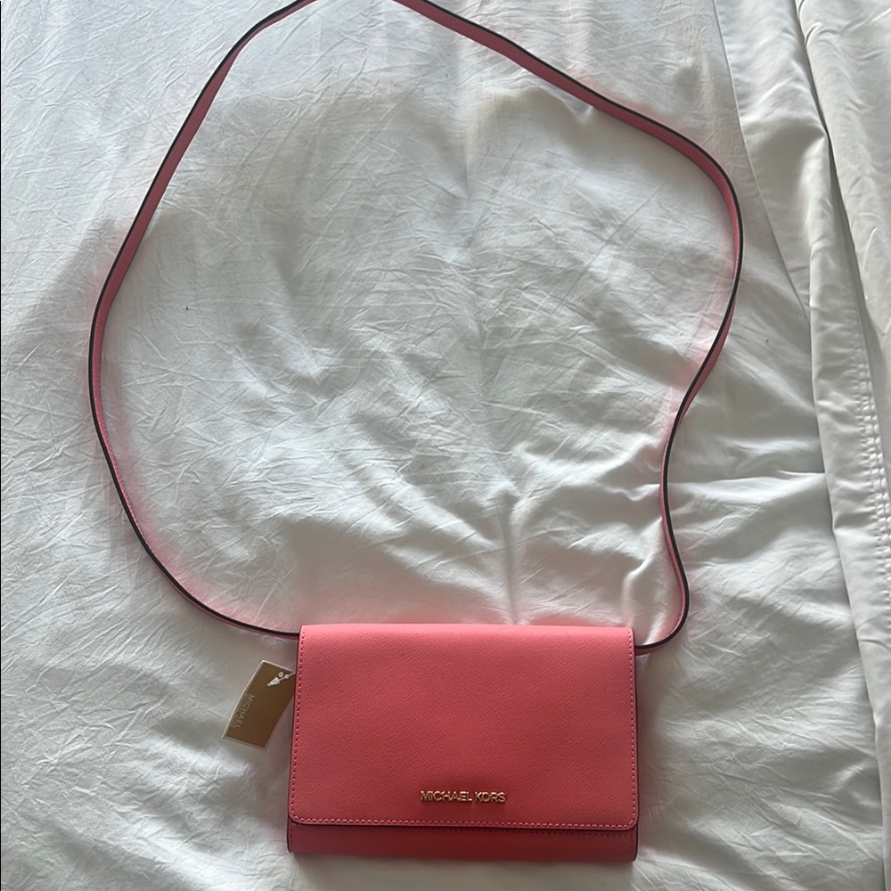 Michael Kors Pink Crossbody Bag with Flap Closure